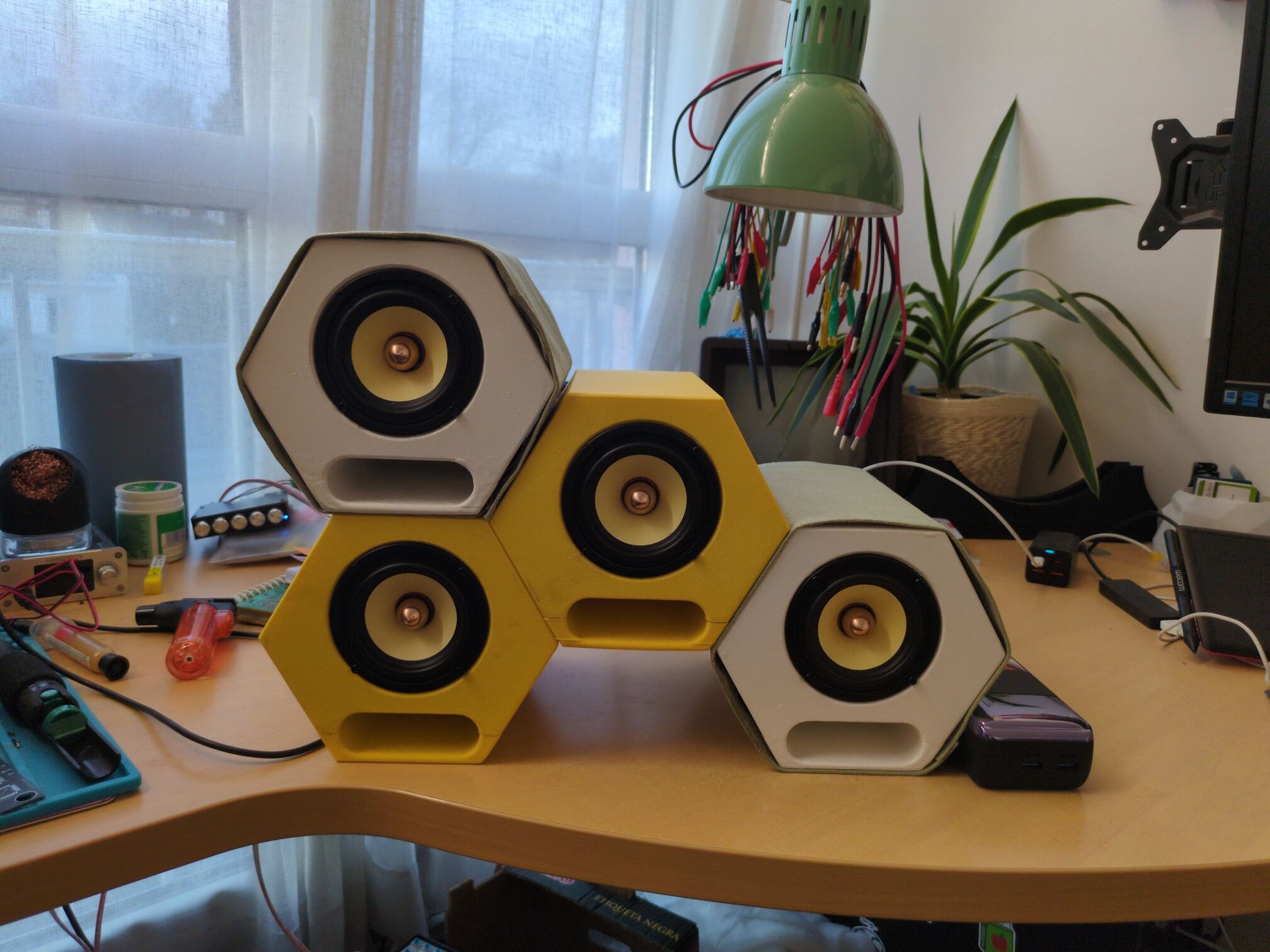 Finished hexagonal speakers in a stack