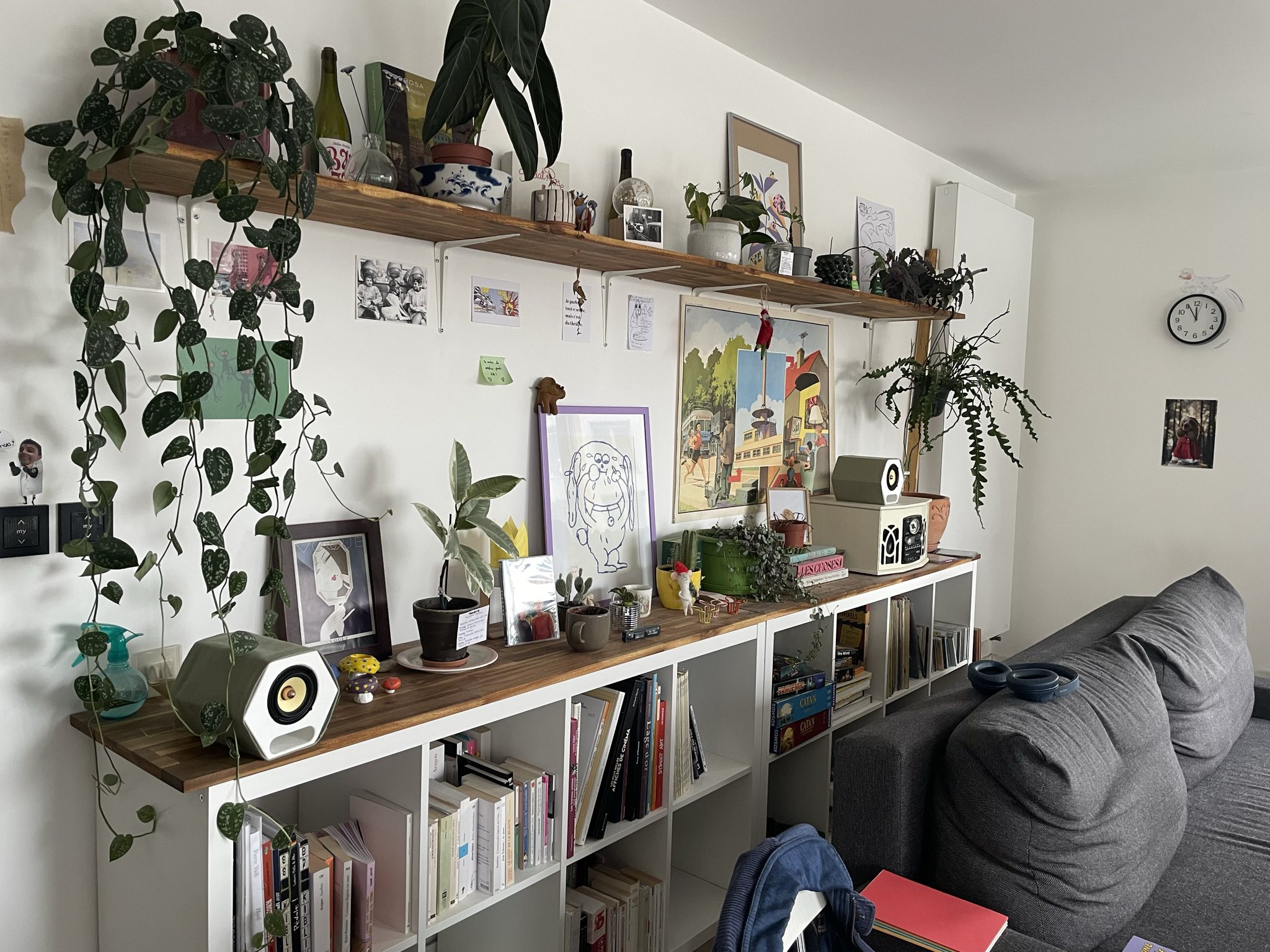 Both speakers placed down on a shelf at my brother's place