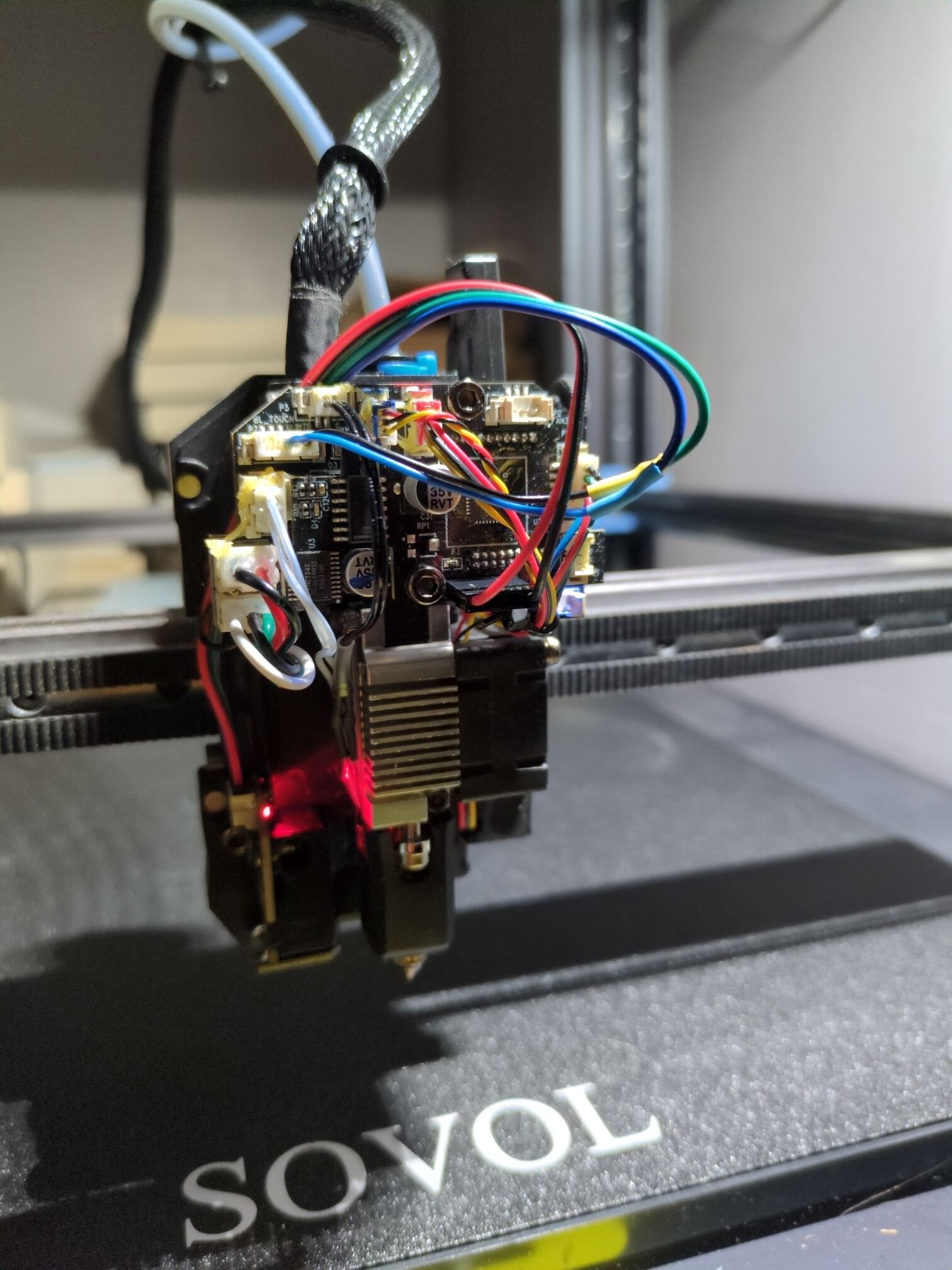 BTT eddy probe taken out of plastic shell and mounted to printhead with the probe holder mentioned earlier